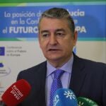 El consejero de la Presidencia, Interior, Diálogo Social y Simplificación Administrativa, Antonio Sanz, atiende a los medios de comunicación momentos antes de la inauguración de la jornada 'Andalucía por el Futuro de Europa' 15/12/2022