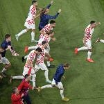 Croatia players celebrate at the end of the World Cup third-place playoff soccer match between Croatia and Morocco at Khalifa International Stadium in Doha, Qatar, Saturday, Dec. 17, 2022. Croatia won 2-1. (AP Photo/Pavel Golovkin)