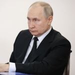 Russian President Vladimir Putin listens to head of Bashkortostan Radiy Khabirov during their meeting in Ufa, the capital of Bashkortostan, Russia, Friday, Jan. 13, 2023. (Sergei Bobylev, Sputnik, Kremlin Pool Photo via AP)