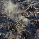Destroyed buildings are seen from above in Antakya, southeastern Turkey, Thursday, Feb. 9, 2023. Thousands who lost their homes in a catastrophic earthquake huddled around campfires and clamored for food and water in the bitter cold, three days after the temblor and series of aftershocks hit Turkey and Syria. (AP Photo/Hussein Malla)