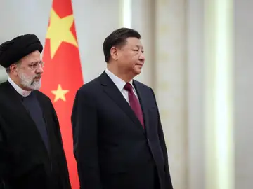President of China Xi Jinping (R) receives Iranian President Ebrahim Raisi ahead of their meeting. President of China Xi Jinping (R) receives Iranian President Ebrahim Raisi ahead of their meeting.