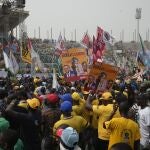 Supporters of Bola Ahmed Tinubu, the presidential candidate of the All Progressives Congress, Nigeria ruling party, attend an election campaign rally at the Teslim Balogun Stadium in Lagos Nigeria, Tuesday, Feb. 21, 2023.