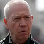 Israeli Defence Minister Yoav Galant visits the scene of a shooting attack in the West Bank town of Hawera