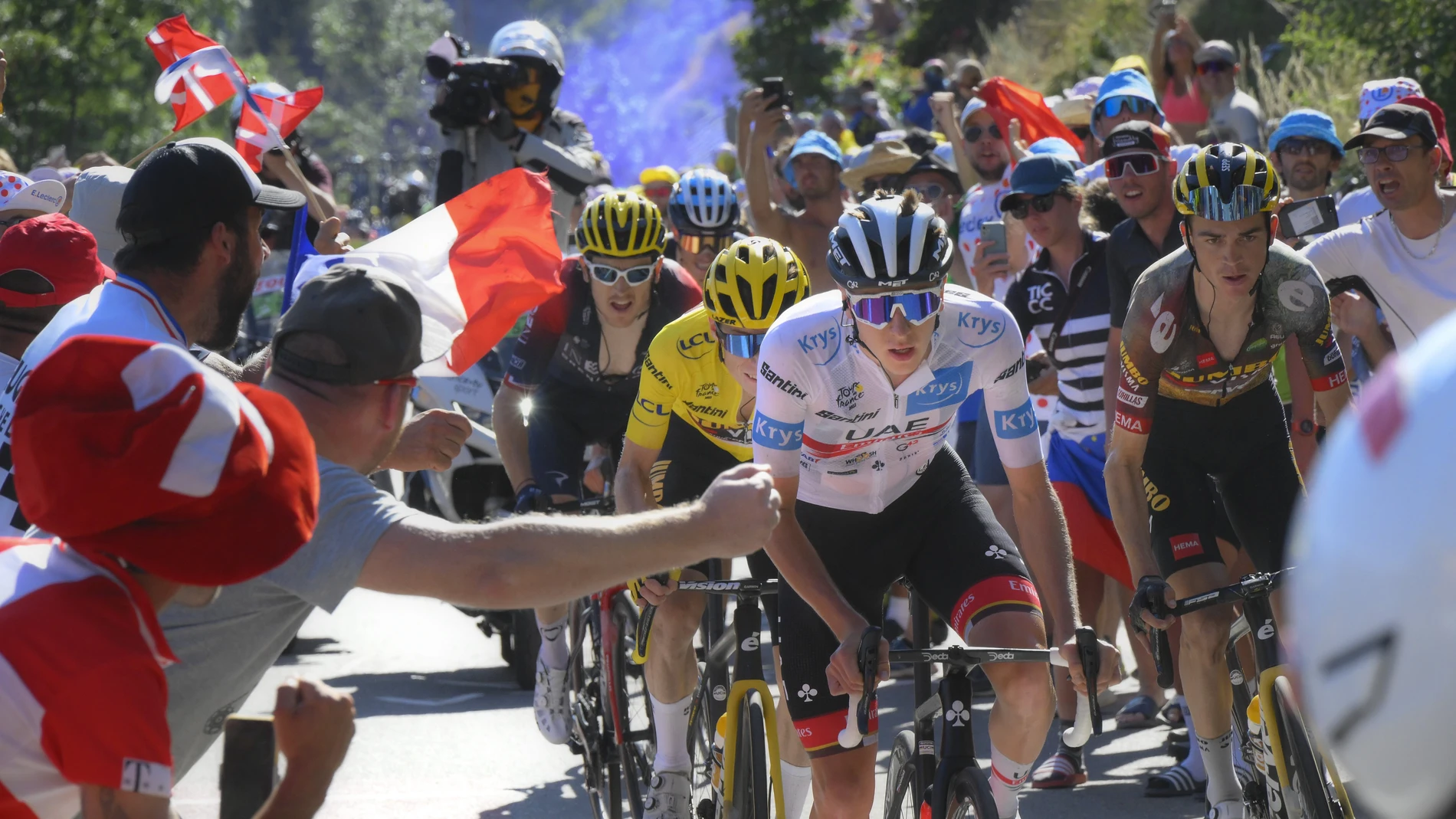Slovenia's Tadej Pogacar, wearing the best young rider's white jersey, attempts to break away from Denmark's Jonas Vingegaard, wearing the overall leader's yellow jersey, Sepp Kuss of the U.S., right, and Britain's Geraint Thomas, left, as they climb Alpe d'Huez during the twelfth stage of the Tour de France cycling race over 165.5 kilometers (102.8 miles) with start in Briancon and finish in Alpe d'Huez, France.