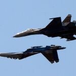 St. Petersburg (Russian Federation).- (FILE) - Two Russian SU-27 aircraft perform during the International Maritime Defence Show (IMDS) in St. Petersburg, Russia, 07 July 2013 (reissued 14 March 2023). The United States European Command (EUCOM) said in a statement that two Russian Su-27 aircraft 'conducted an unsafe and unprofessional intercept' with a US unmanned MQ-9 aircraft that was operating within international airspace over the Black Sea on 14 March 2023. The incident occurred at about 7:03 AM (CET) when one of the Russian aircraft struck the propeller of the MQ-9 causing US forces to bring the unmanned aircraft down in international waters, the statement added. (Rusia, Estados Unidos, San Petersburgo)