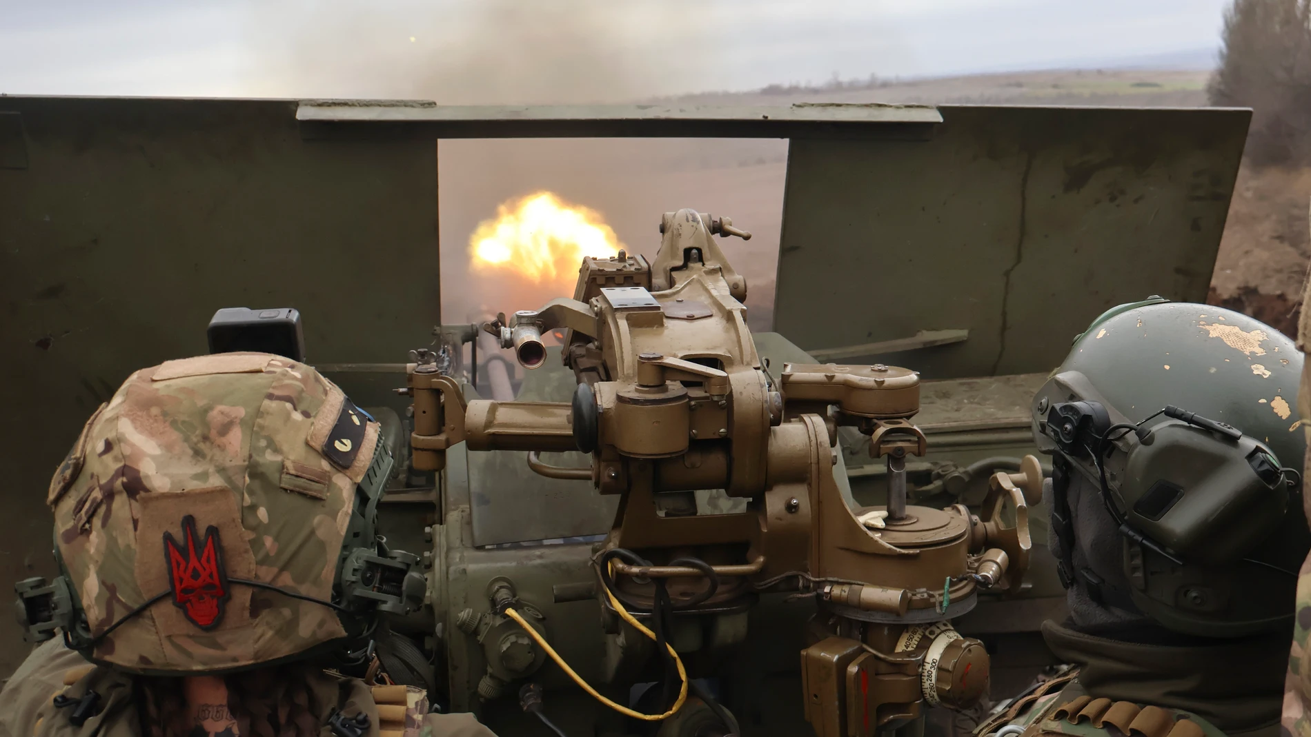 Ukrainian soldiers fire at the frontline near Bakhmut, Donetsk region, Ukraine, Saturday, March 18, 2023. (AP Photo/Roman Chop)