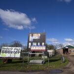 An upside-down Dutch flag was hung on a barn in protest against the Dutch government's plans to drastically reduce emissions of nitrogen pollutants by the country's agricultural sector, as posters of political parties for the provincial elections, with one of the Farmer Citizen Movement BBB, left, are seen at a farm in Okkenbroek, eastern Netherlands, Wednesday, March 15, 2023. Local elections with national consequences opened Wednesday in the Netherlands as voters cast their ballots for the country's 12 provincial legislatures, which in turn elect the national parliament's upper house.
