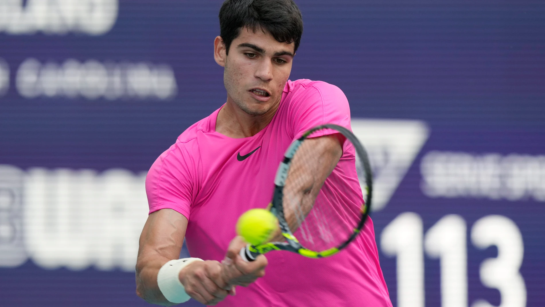 Carlos Alcaraz of Spain returns to Dusan Lajovic of Serbia during the Miami Open tennis tournament, Sunday, March 26, 2023, in Miami Gardens, Fla. (AP Photo/Marta Lavandier)