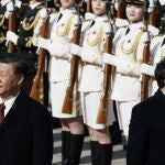 Chinese President Xi Jinping, left, and France's President Emmanuel Macron review troops during a welcome ceremony at the Great Hall of the People in Beijing, China, Thursday, April 6, 2023. 