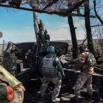Ukrainian artillerymen prepare a BM-21 Grad multiple rocket launcher to fire towards Russian positions on the frontline, in Donetsk region on April 17, 2023.