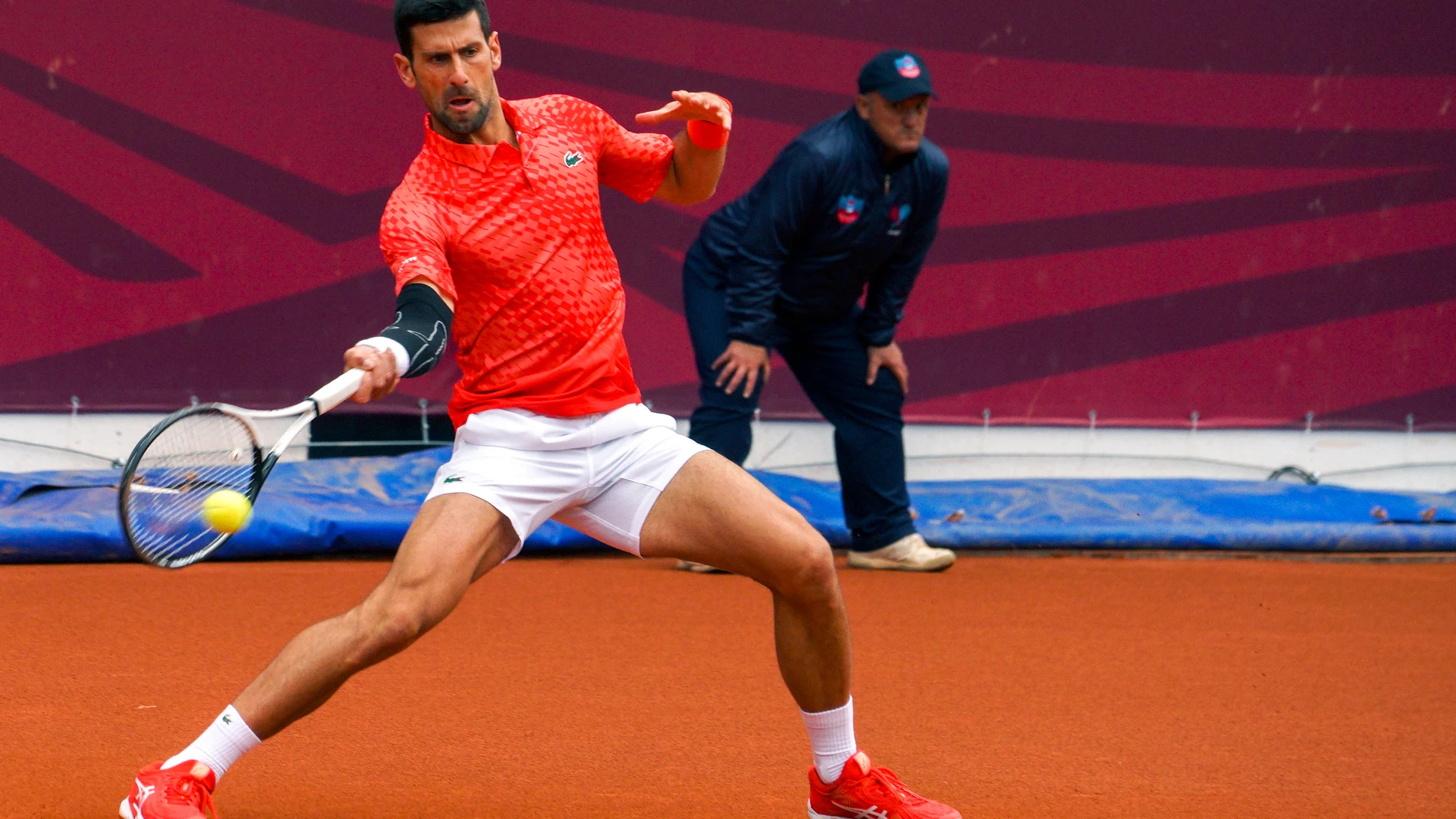 Novak Djokovic of Serbia returns a ball to Luca Van Assche of France during their tennis match of the Srpska Open tennis tournament in Banja Luka, Bosnia, Wednesday, April 19, 2023. (AP Photo/Radivoje Pavicic)