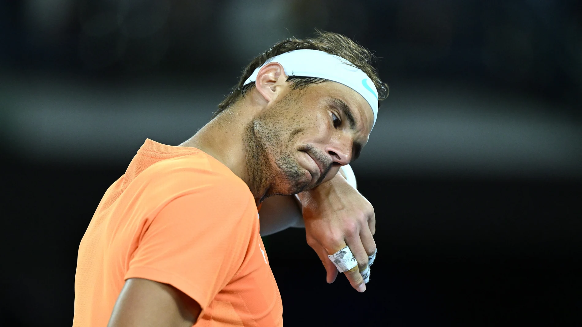 Melbourne (Australia), 18/01/2023.- Rafael Nadal of Spain react during his match against Mackenzie McDonald of the USA of the USA of the 2023 Australian Open tennis tournament at Melbourne Park in Melbourne, Australia, 18 January 2023. (Tenis, Abierto, España, Estados Unidos)