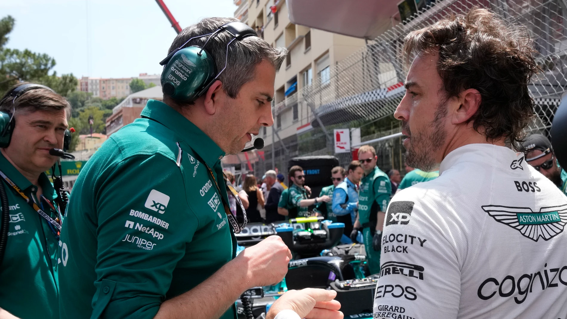 Aston Martin driver Fernando Alonso of Spain, right, prior to the Monaco Formula One Grand Prix, at the Monaco racetrack, in Monaco, Sunday, May 28, 2023. (AP Photo/Luca Bruno)