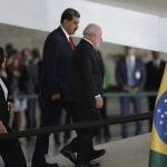Brazilian President Luiz Inacio Lula da Silva, right, and Venezuela's President Nicolas Maduro walk to their bilateral meeting at Planalto palace in Brasilia, Brazil, Monday, May 29, 2023. 