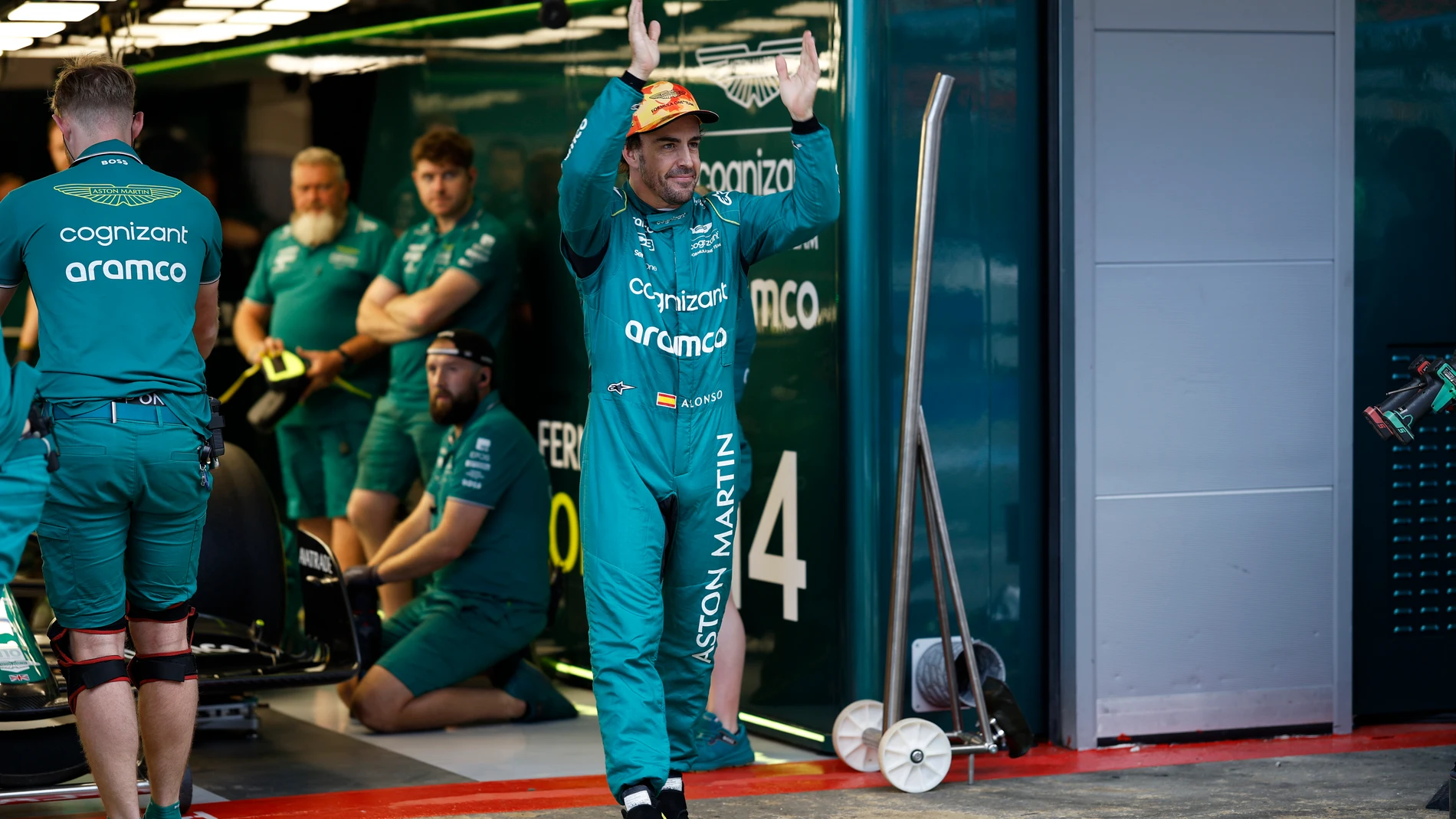 Aston Martin driver Fernando Alonso of Spain gestures to fans at the end of the second practice session for Sunday's Spanish Formula One Grand Prix, at the Barcelona Catalunya racetrack in Montmelo, Spain, Friday, June 2, 2023. (AP Photo/Joan Monfort)