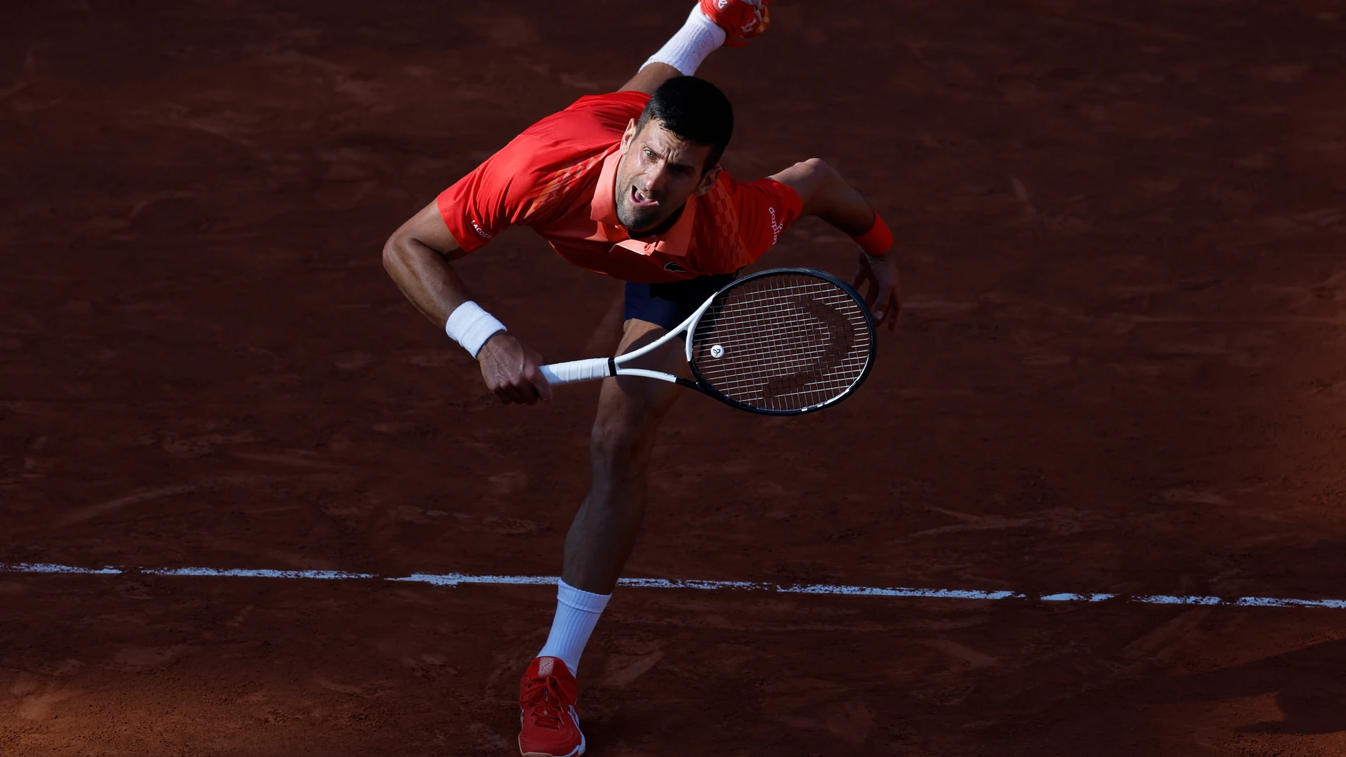 Serbia's Novak Djokovic serves against Russia's Karen Khachanov during their quarterfinal match of the French Open tennis tournament at the Roland Garros stadium in Paris, Tuesday, June 6, 2023. (AP Photo/Jean-Francois Badias)