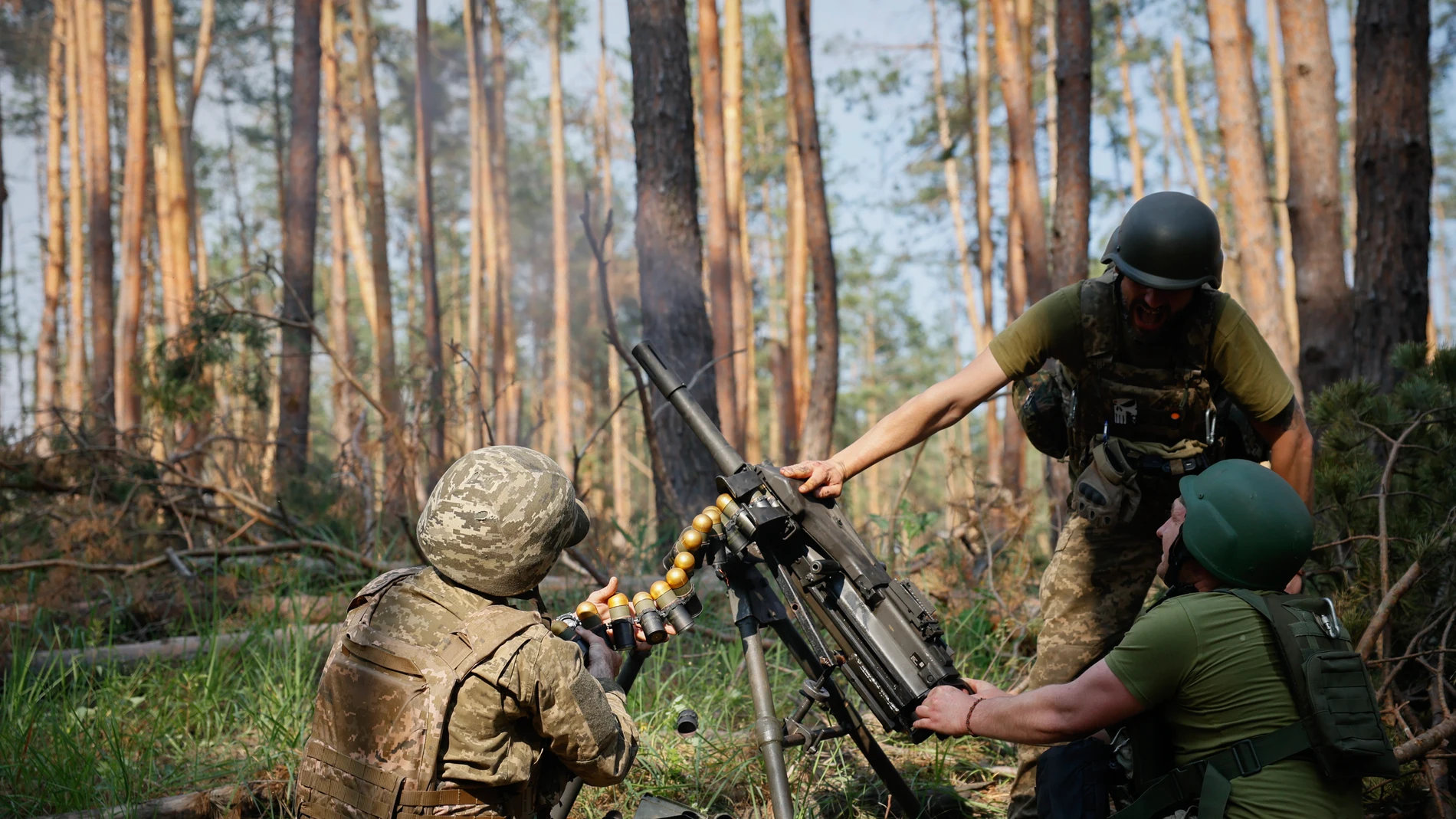 Ukrainian soldiers fire the grenade launcher towards the Russian positions on the frontline near Kreminna, Luhansk region, Ukraine, Thursday, June 8, 2023. (Roman Chop via AP)