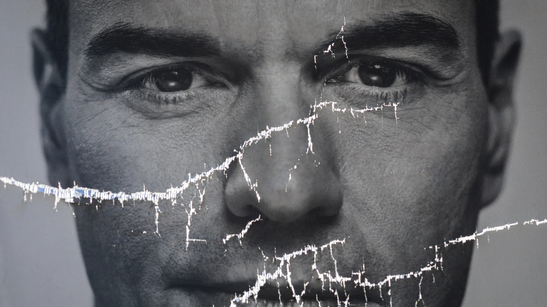 A partially damaged poster of Spanish Prime Minister and Socialist Party candidate Pedro Sanchez flaps in Parla, outskirts Madrid, Spain.