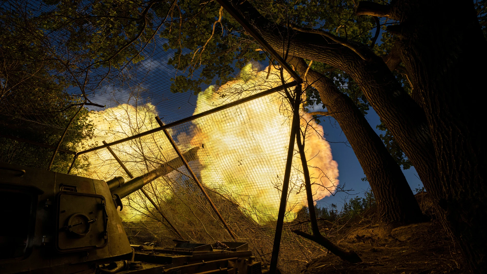 A Ukrainian self propelled artillery of 30th brigade fires towards Russian position in Donetsk region, Ukraine, Tuesday, June 20, 2023. (AP Photo/Evgeniy Maloletka)