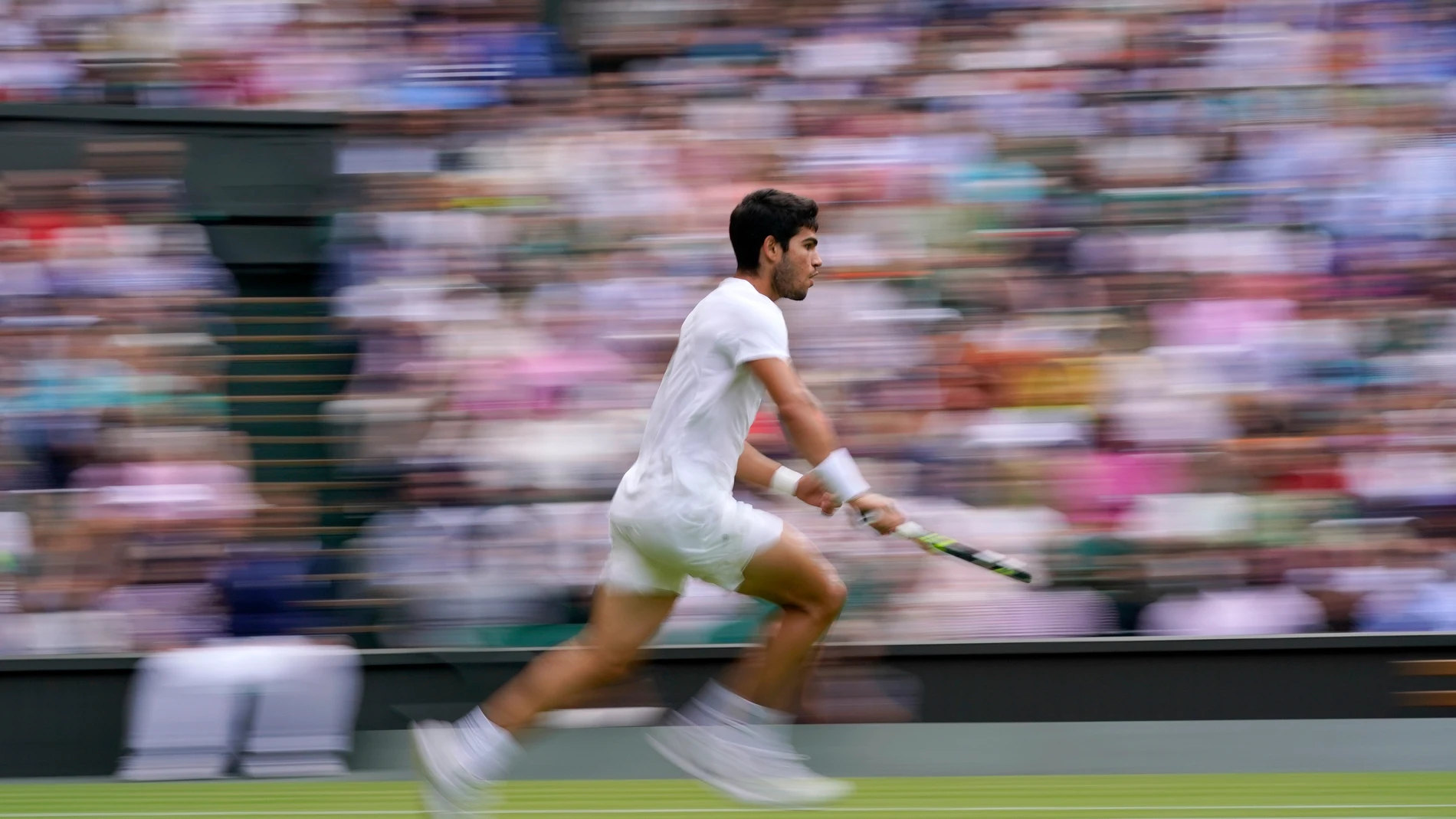 Spain's Carlos Alcaraz races to return to Italy's Matteo Berrettini in a men's singles match on day eight of the Wimbledon tennis championships in London, Monday, July 10, 2023. (AP Photo/Alberto Pezzali)