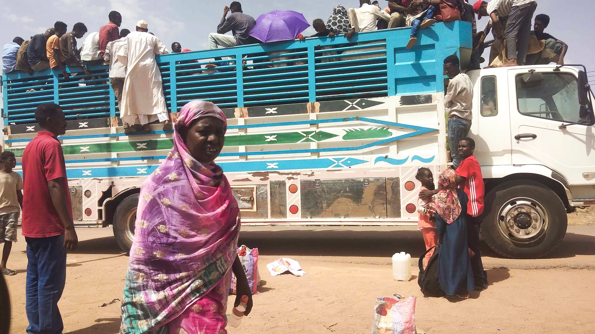 FILE - People board a truck as they leave Khartoum, Sudan, on June 19, 2023. A raging conflict in Sudan has driven more than 3.1 million people from their homes, including over 700,000 who fled to neighboring countries, the United Nations said Wednesday, July 21, amid growing concerns that the country is sliding into a “full-scale civil war.” (AP Photo, File)