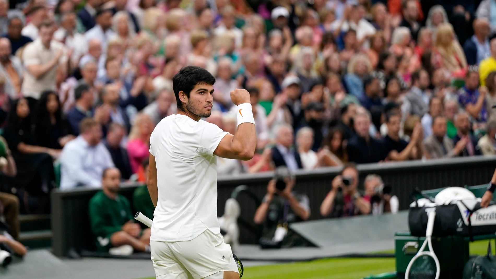 Spain's Carlos Alcaraz celebrates winning a set against Russia's Daniil Medvedev during their men's singles semifinal match on day twelve of the Wimbledon tennis championships in London, Friday, July 14, 2023. (AP Photo/Alberto Pezzali)