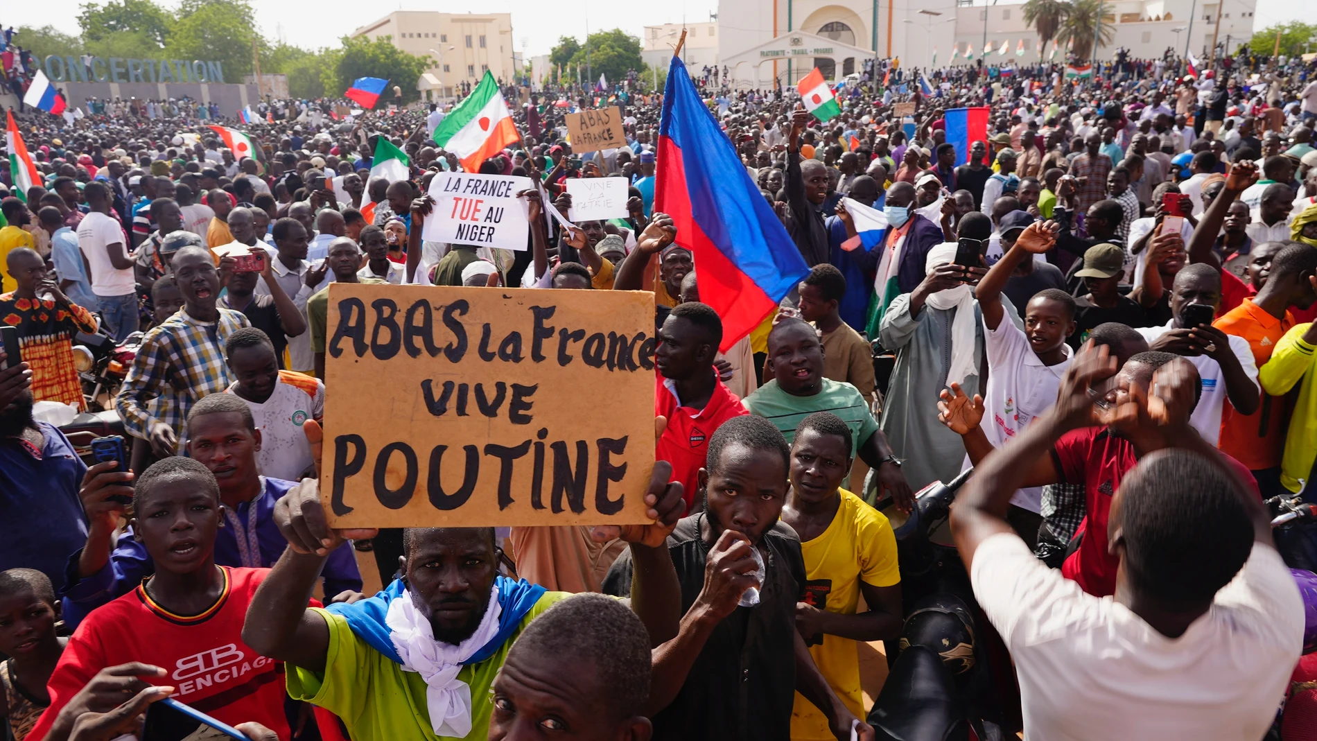 Nigeriens participate in a march called by supporters of coup leader Gen. Abdourahmane Tchiani in Niamey, Niger, Sunday, July 30, 2023. Days after mutinous soldiers ousted Niger's democratically elected president, uncertainty is mounting about the country's future and some are calling out the junta's reasons for seizing control. The sign reads: "Down with France, long live Putin." (AP Photo/Sam Mednick)