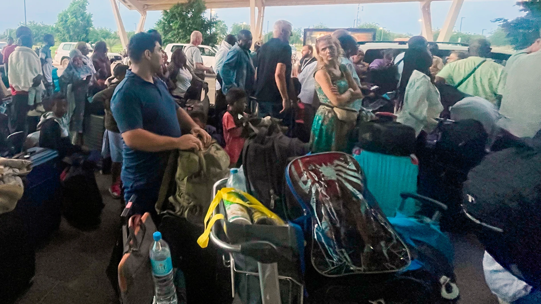 French and other nationals gather at the international Airport to be airlifted back to France on a French military aircraft, in Niamey, Niger, Wednesday, Aug. 2, 2023, to be airlifted back to France on a French military aircraft. French forces in the capital, Niamey, evacuated hundreds of mostly French nationals to Paris on two flights Tuesday, following concerns that their citizens and other Europeans risked becoming trapped by last week’s military coup, which ousted and detained President M...