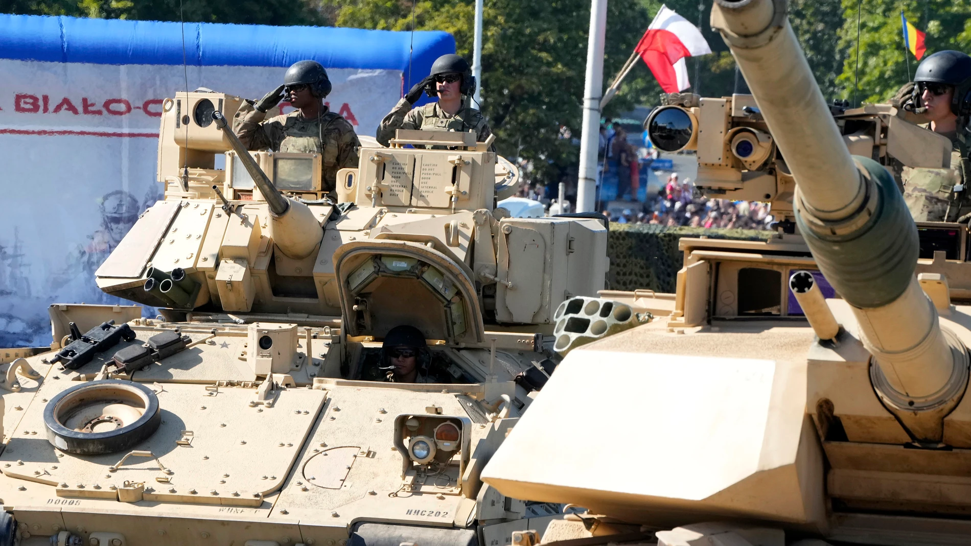 U.S.-made Abrams tanks purchased by Poland take part in a massive military parade to celebrate the Polish Army Day, commemorating the 1920 battle in which Polish troops defeated advancing Bolshevik forces, in Warsaw, Poland, Tuesday, Aug. 15, 2023. Poland is holding a military parade to showcase its state-of-the-art weapons and defense systems, as war rages across its southeastern border in neighboring Ukraine and ahead of parliamentary elections scheduled for Oct. 15. (AP Photo/Czarek Sokolo...