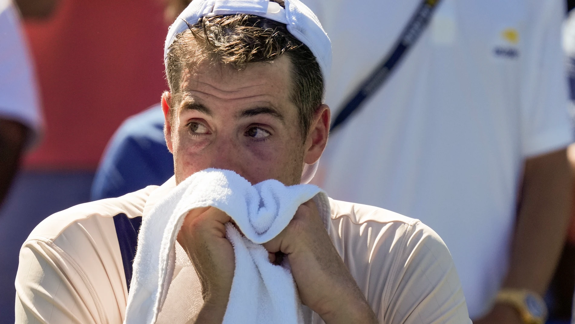 John Isner, of the United States, reacts after losing to Michael Mmoh, of the United States, during the second round of the U.S. Open tennis championships, Thursday, Aug. 31, 2023, in New York. (AP Photo/John Minchillo)