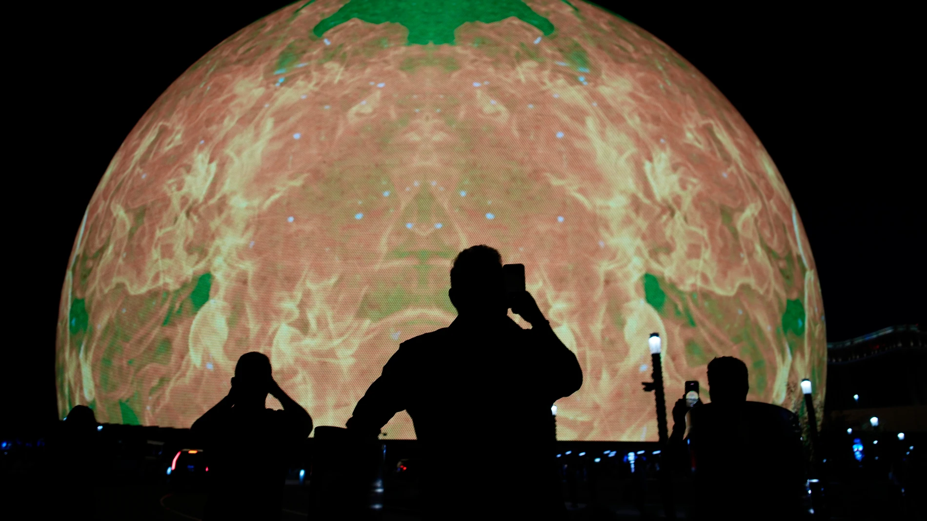 People take pictures during the opening night of the Sphere, Friday, Sept. 29, 2023, in Las Vegas. (AP Photo/John Locher)