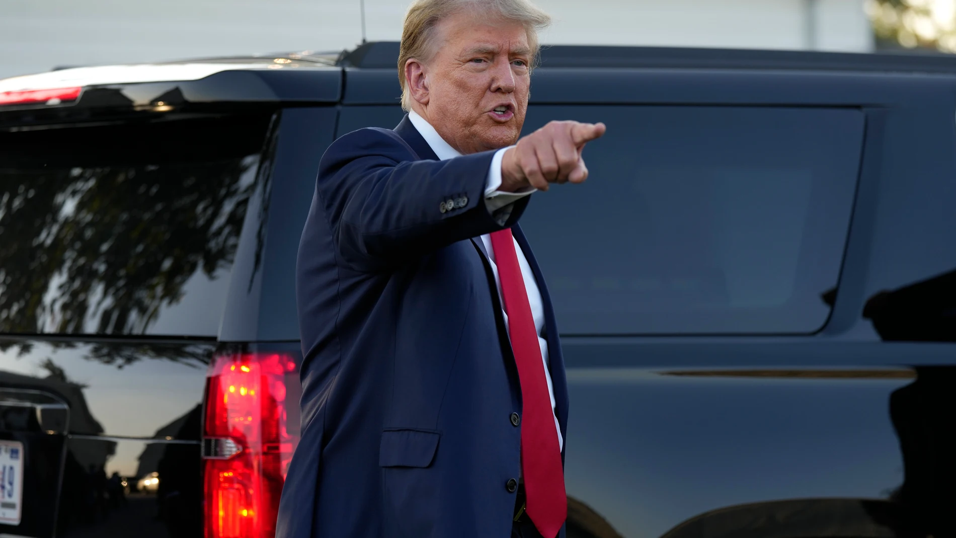 Former President Donald Trump speaks to reporters during a visit to the Vande Voort family farm, Sunday, Oct. 1, 2023, in Leighton, Iowa. (AP Photo/Charlie Neibergall)