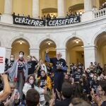 Demonstrators, calling for a ceasefire in the ongoing war between Israel and Hamas, protest inside the Cannon House Office Building at the Capitol in Washington.