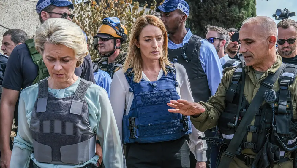 Ursula von der Leyen (L), President of the European Commission, and Roberta Metsola (C), President of the European Parliament, visit Kibbutz Kfar Aza.