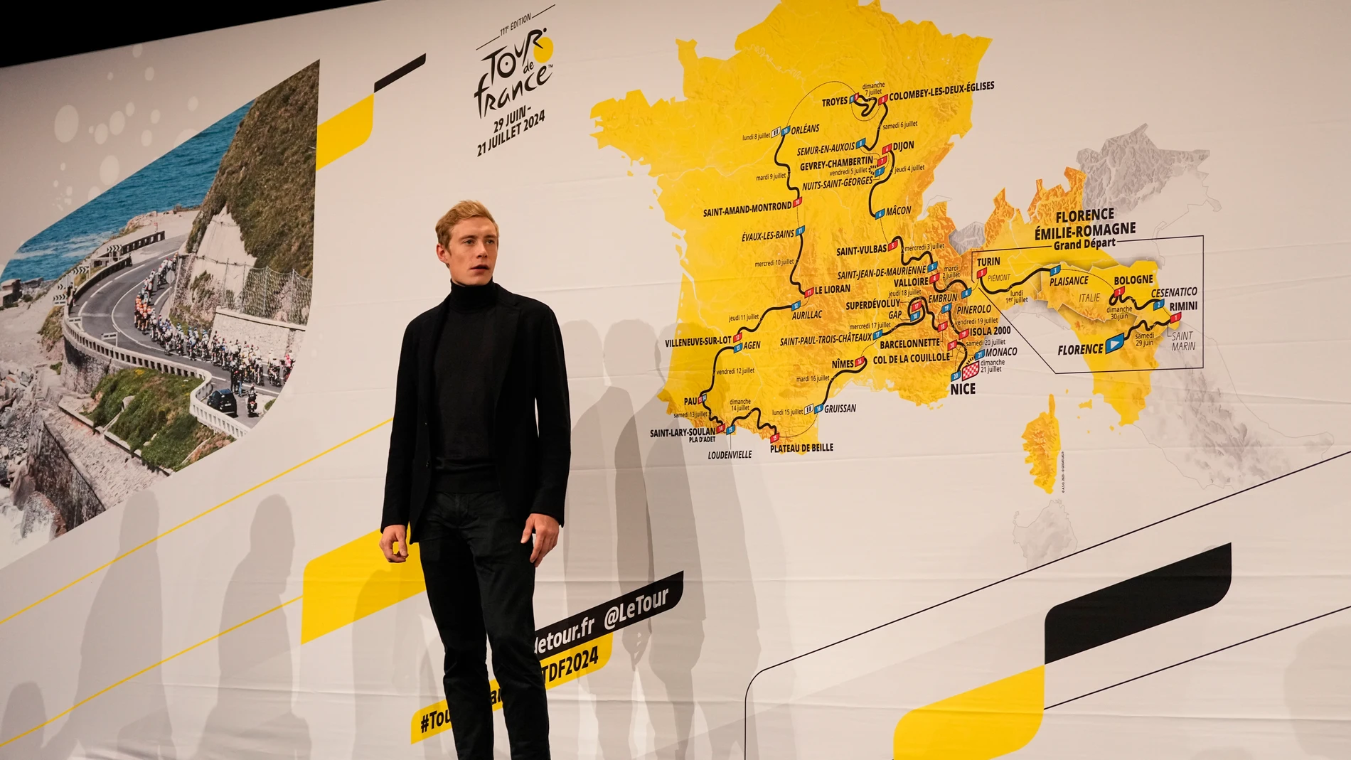 Tour de France 2023 winner Denmark's Jonas Vingegaard poses in front of the 2024 Tour de France cycling race roadmap during its unveiling in Paris, Wednesday, Oct 25, 2023. (AP Photo/Pavel Golovkin)