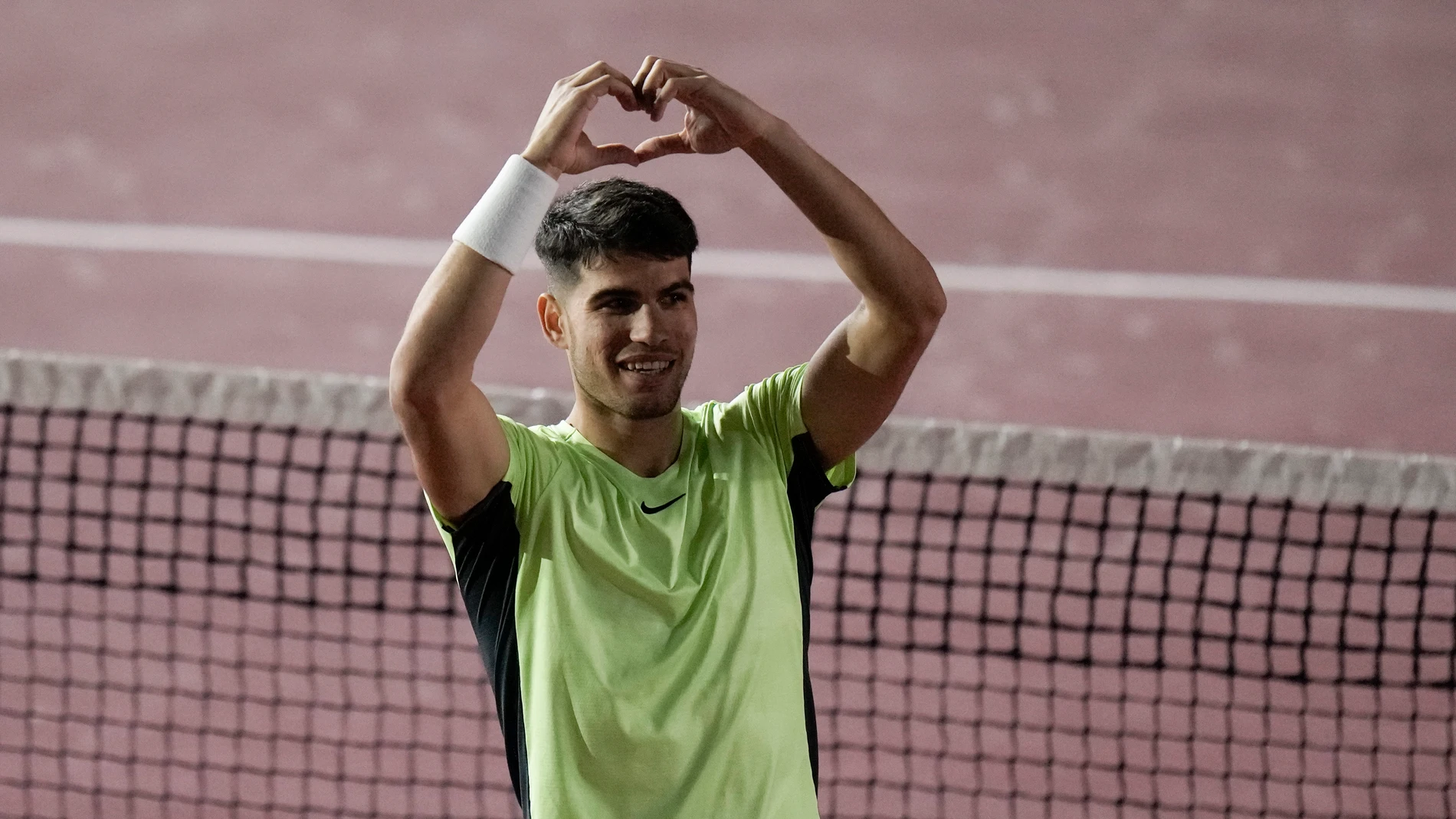 Spain's Carlos Alcaraz celebrates after winning his match against Tommy Paul of the United States at the Plaza de Toros bullring in Mexico City, Wednesday, Nov. 29, 2023. (AP Photo/Eduardo Verdugo)