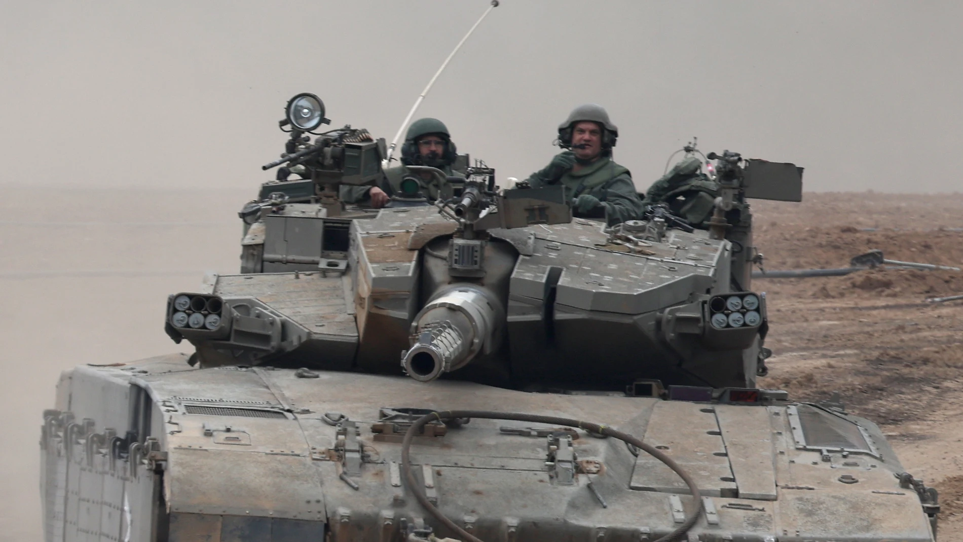 Undisclosed (Israel), 05/12/2023.- Israeli soldiers aboard an armoured fighting vehicle maneuver at an area near the border with the Gaza Strip, in southern Israel, 05 December 2023. Israeli forces resumed military strikes on Gaza after a week-long truce ended on 01 December. More than 15,500 Palestinians and at least 1,200 Israelis have been killed, according to the Palestinian Ministry of Health and the Israel Defense Forces (IDF), since Hamas militants launched an attack against Israel fro...