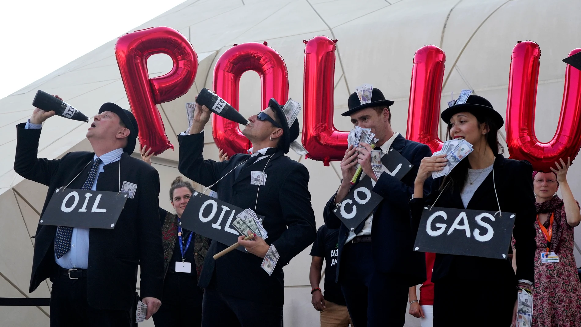 Activists protest against fossil fuels at the COP28 U.N. Climate Summit, Sunday, Dec. 10, 2023, in Dubai, United Arab Emirates. (AP Photo/Rafiq Maqbool)