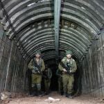 Israeli soldiers are seen in a tunnel that the military says Hamas militants used to attack the Erez crossing in the northern Gaza Strip, Friday, Dec. 15, 2023.