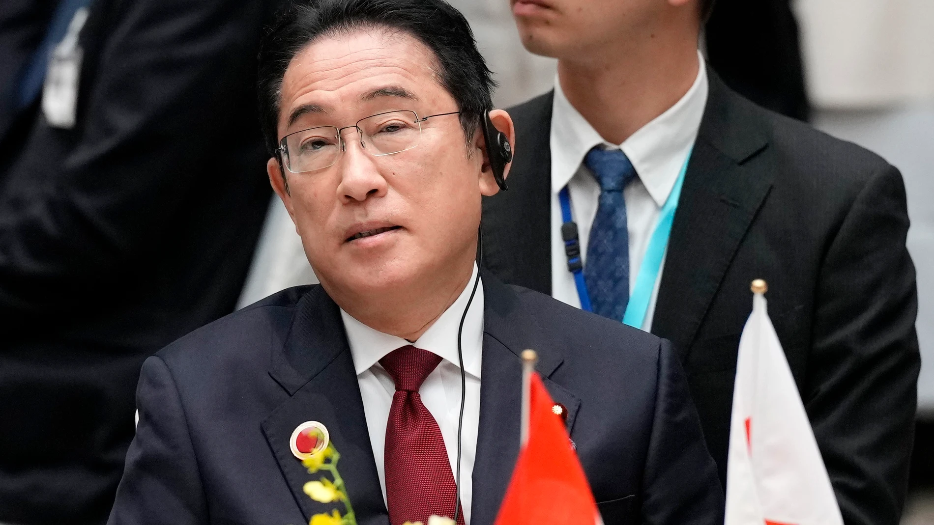 Japan's Prime Minister Fumio Kishida, listens the speech of Indonesian President Joko Widodo at the 50th anniversary of the ASEAN-Japan Friendship and Cooperation luncheon meeting at KEIDANREN (Japan Business Federation) in Tokyo, Monday, Dec. 18, 2023. (AP Photo/Eugene Hoshiko, Pool)