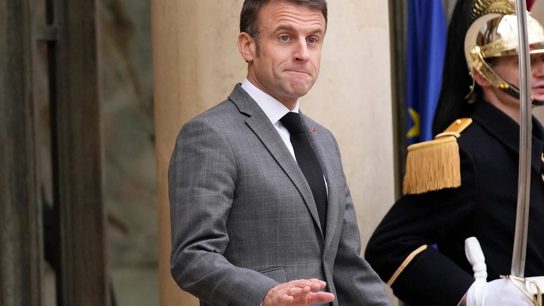 French President Emmanuel Macron gestures as he waits for Czech Republic's President Petr Pavel, Wednesday, Dec. 20, 2023 at the Elysee Palace in Paris. The French parliament approved a divisive immigration bill intended to strengthen France's ability to deport foreigners considered undesirable, prompting a heated debate after the far-right decided to back the measure. The vote comes after parliament members from French President Emmanuel Macron's centrist majority and the conservative party ...