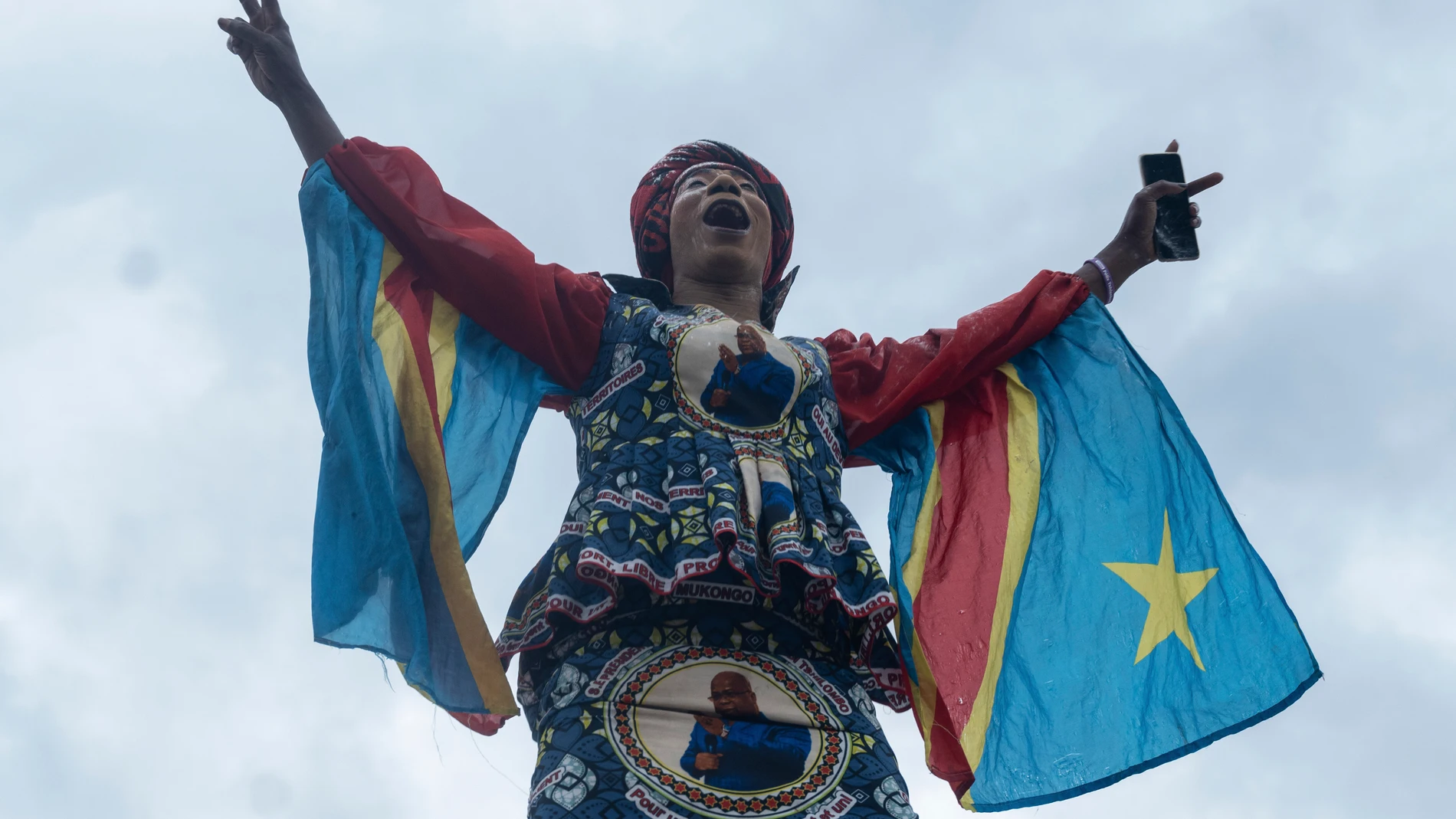 A supporter of Felix Tshisekedi celebrates the victory of the candidate in Kinshasa, Democratic Republic of the Congo, Sunday, Dec. 31, 2023. Congo’s election commission says President Felix Tshisekedi has won reelection with more than 70% of the vote. The preliminary results of the Dec. 20 election were announced on Sunday in the capital, Kinshasa. (AP Photo/Samy Ntumba Shambuyi)