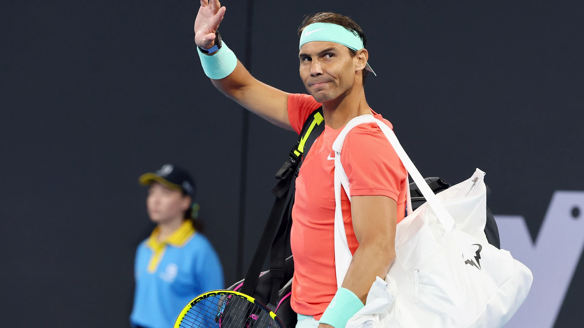 Rafael Nadal of Spain waves to the crowd in his doubles match against Australia's Max Purcell and Jordan Thompson during the Brisbane International tennis tournament in Brisbane, Australia, Sunday, Dec. 31, 2023. (AP Photo/Tertius Pickard)