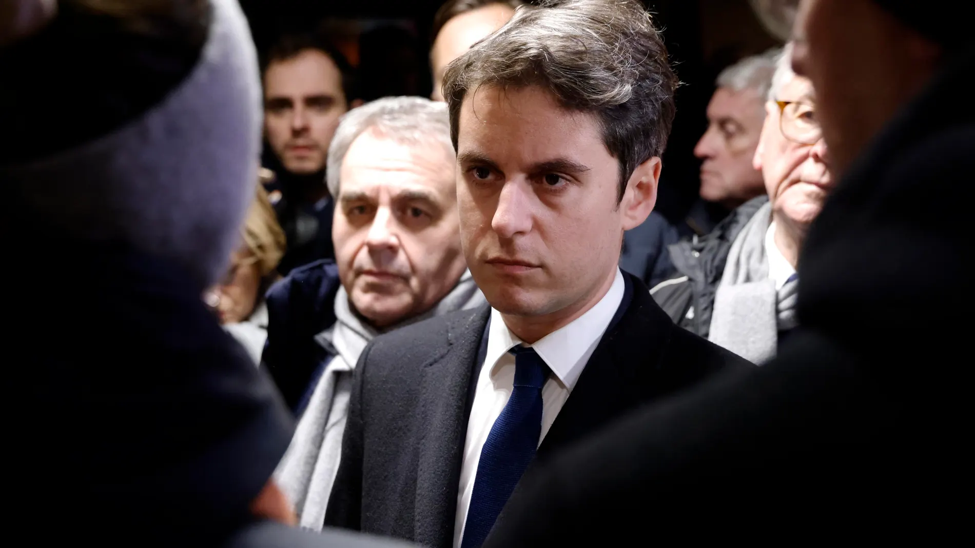Clairmarais (France), 09/01/2024.- Hauts-de-France Regional Council president Xavier Bertrand (rear L) looks on as new French Prime Minister Gabriel Attal (C) speaks to local residents affected by flooding in the area as he visits a cafe and tobacconist in Clairmarais, northern France, 09 January 2024. Attal made his first official visit to the residents affected by the floods in the Pas-de-Calais department, northern France, following the handover ceremony at the Hotel Matignon in Paris. (In...