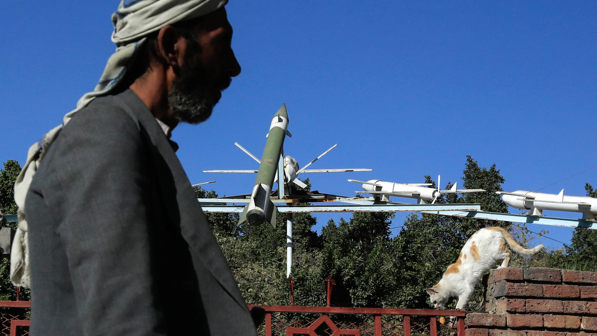 Sana'a (Yemen), 10/01/2024.- A person passes a display of mock Houthis-made drones and missiles at a square in Sana'a, Yemen, 10 January 2024. According to the Houthis military spokesman Yahya Sarea, Yemen's Houthis have launched a large-scale missile and drone attack against international shipping lanes in the Red Sea, in response to a previous US Navy attack on Houthi boats in the Red Sea on 31 December 2023, killing 10 Houthi fighters. The US Department of Defense had announced in December...