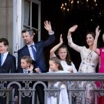 Denmark's Crown Prince Frederik (2-L), Crown Princess Mary (2-R), their children and Queen Margrethe II (R) wave on the balcony of Amalienborg Castle on the Crown Prince's 50th birthday, in Copenhagen, Denmark