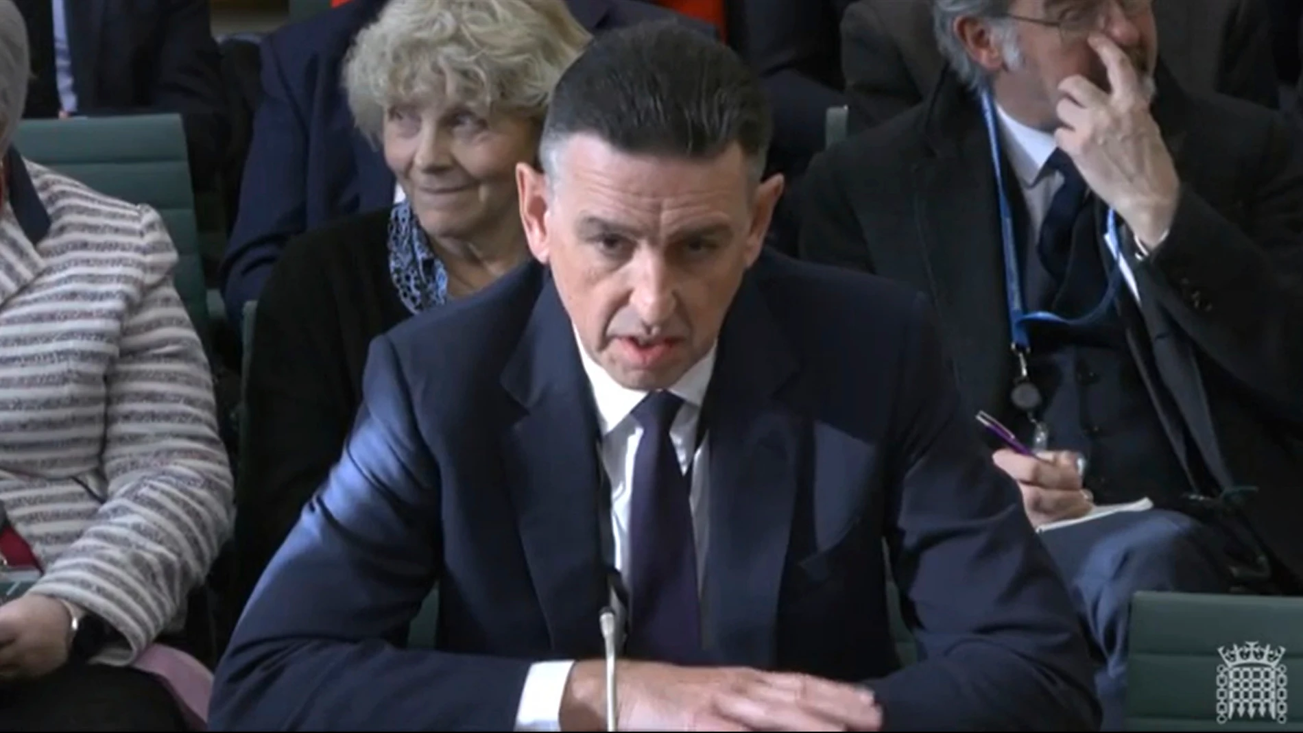 In this image taken from video made available by House of Commons, Paul Patterson, director of Fujitsu Services Ltd, gives evidence to the Business and Trade Committee at the Houses of Parliament, London, Tuesday Jan. 16, 2024. (House of Commons via AP)