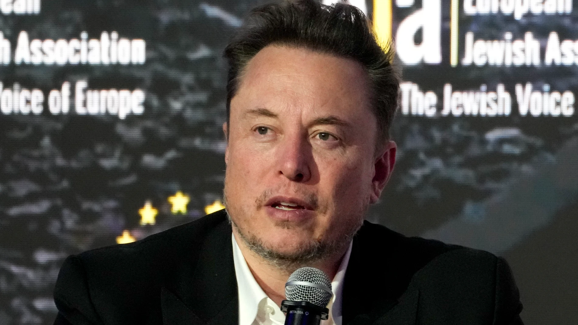 Tesla and SpaceX's CEO Elon Musk addresses the European Jewish Association's conference, in Krakow, Poland, Monday, Jan. 22, 2024. Musk visited earlier in the day the site of the Auschwitz-Birkenau Nazi German death camp in Oswiecim, Poland, the private visit apparently took place in response to calls from some Jewish religious leaders for Musk to see with his own eyes the most symbolic site of the horrors of the Holocaust. (AP Photo/Czarek Sokolowski)