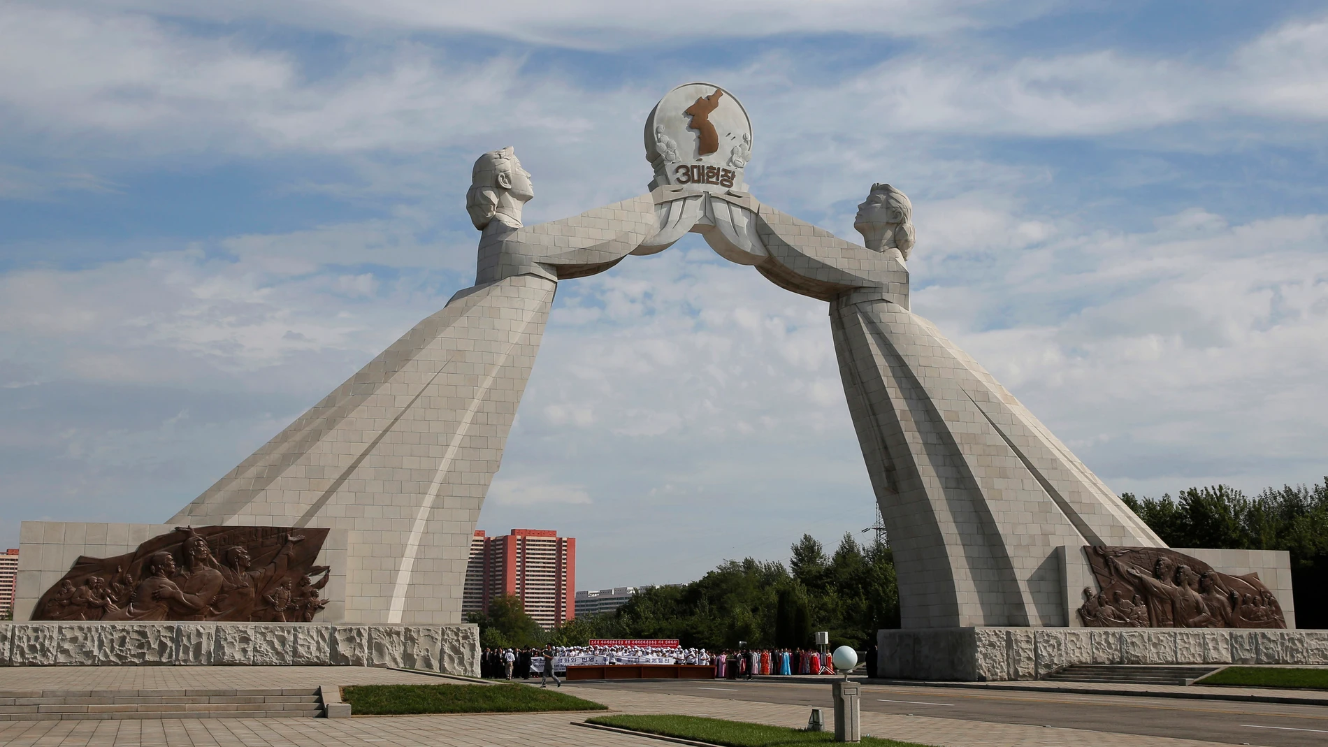 FILE - This photo shows the Arch of Reunification, a monument to symbolize the hope for eventual reunification of the two Koreas, in Pyongyang, North Korea, on Sept. 11, 2018. The monument appeared gone in satellite images taken by Planet Labs Tuesday morning, although it was unclear exactly when or how it was taken down, said NK News, a North Korea-focused news site. The Associated Press couldn’t immediately confirm the report independently. (AP Photo/Kin Cheung, File)