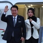 South Korea's President Yoon Suk Yeol and his wife Kim Keon Hee disembark from an aircraft after landing at London Stansted Airport, for a three-day state visit to the UK. 